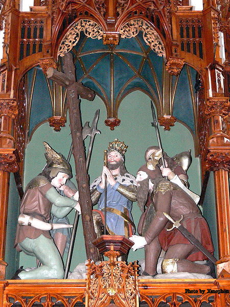 St. Oswald and his men praying before the wooden cross made before the Battle at Bede Denis-burn. This carving is over the Main altar of the 14th century Church of St. Oswald bei Haslach in Upper Austria.