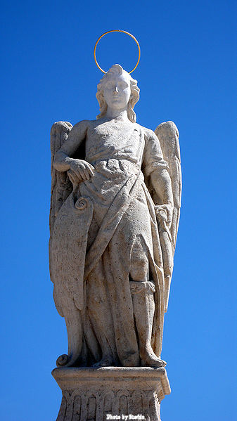 Statue of Saint Raphael by Bernabé Gómez del Río on the Roman Bridge in Cordoba - Spain