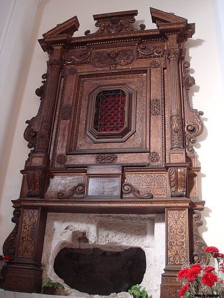 The former grave of Saint Lucy, now empty, but embellished by reliefs dating from the Norman period and by a rich baroque wood frame.