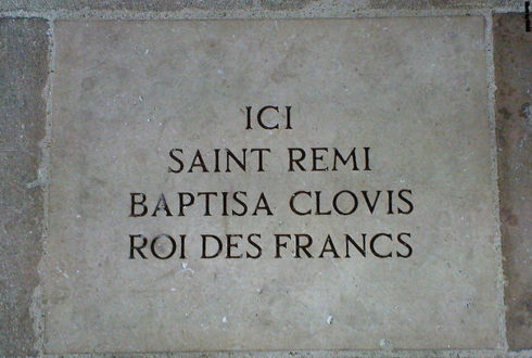 Paving stone in the nave of Notre Dame de Reims, France. Reads, in French: "Here Saint Remi (Saint Remigius) baptized Clovis king of the Franks"