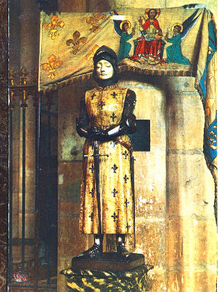 Statue of St. Joan of Arc with her banner in the Notre-Dame Reims Cathedral, France