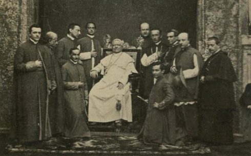 Pope Pius IX surrounded by clerics.