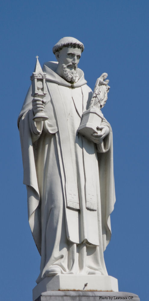 Statue of St Hyacinth overlooking Rosary Square in Lourdes.