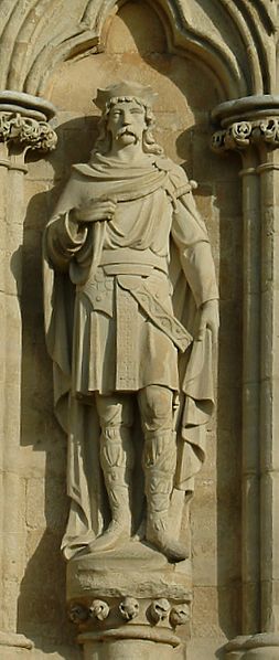 A statue of St. Edmund the Martyr on the West Front of Salisbury Cathedral, UK.