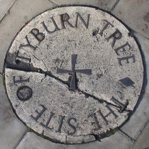 Stone marking the site of the Tyburn tree on the traffic island at the junction of Edgware Road, Marble Arch and Oxford Street