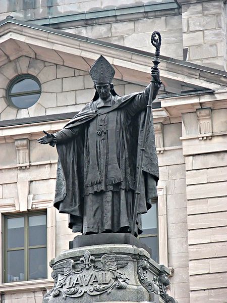 Statue of Bl. François de Montmorency-Laval, standing in front of the Bureau de Poste building in Old Quebec. Photo taken Andrea Schaffer.