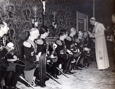 The Pontifical Noble Guard pays homage to Pope Pius XII, Christmas 1945. The Pope's Nephew, Prince Giulio Pacelli, is the third guard from the left.