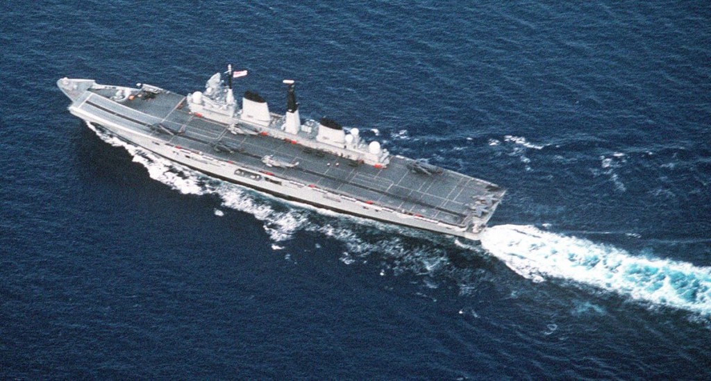 An aerial port quarter view of the British aircraft carrier HMS INVINCIBLE (R-05) underway during the NATO exercise Display Determination '91
