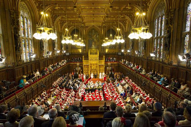 The Lords chamber is packed with guests listening to the Queen's Speech. Photo by UK Parliament