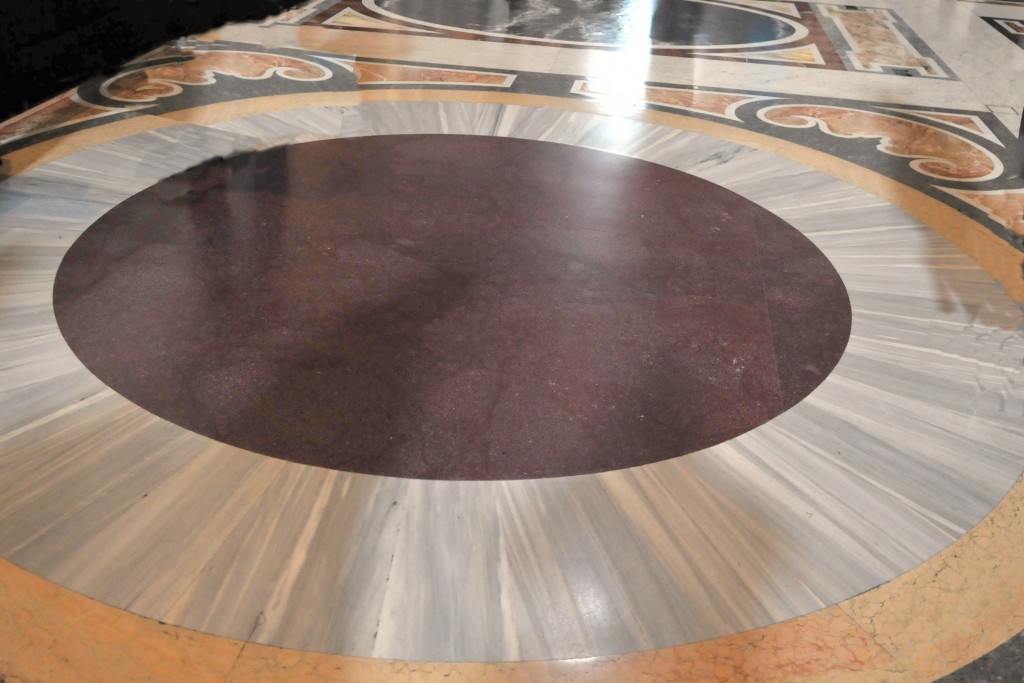 At St. Peter’s Basilica in Rome, a few steps after entering the central nave, one admire the famous “porphyretic circle,” a great disc of porphyry—a superb, wine-colored marble. Upon it, Charlemagne was sacred Emperor by Pope Leo III at Christmas of the year 800.