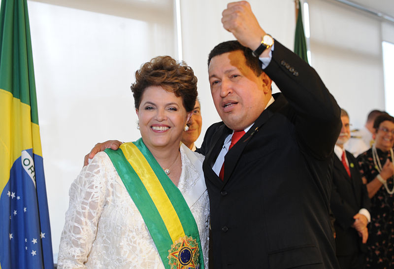 Former Brazilian President Dilma Vana Rousseff, who was impeached in August 2106 and removed from office. Pictured here with one of her many leftist supporters, Hugo Chavez, President of Venezuela. Photo by Agência Brasil.