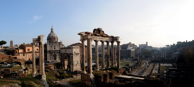 The ruins of the Temple of Saturn with the Church of Saints Luca and Martina and the Mamertine Prison behind it.