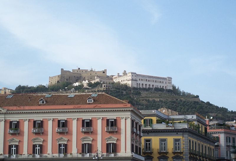 The medieval fortress Castel Sant'Elmo, on the left, located on a hilltop next to the Certosa di San Martino on the right, overlooking Naples, Italy.